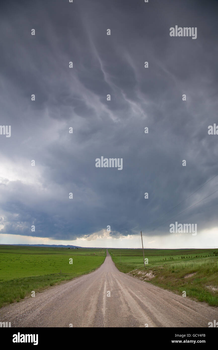 A storm over a dirt road near Slater, Wyoming, May 31, 2014. Stock Photo