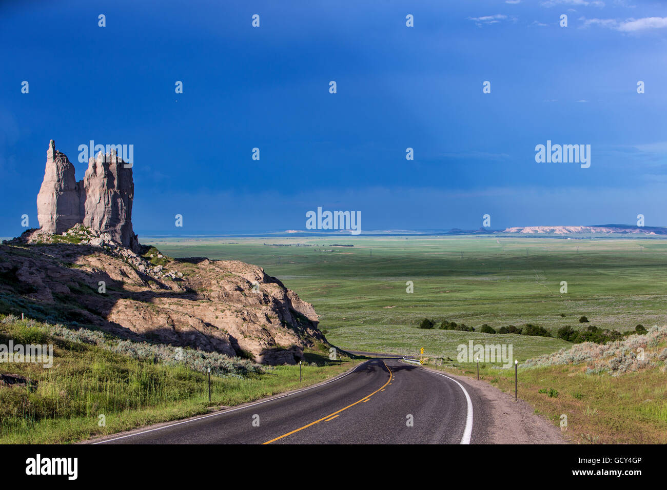 A road leads into a valley near Hawk Springs, Wyoming, May 31, 2014. Stock Photo
