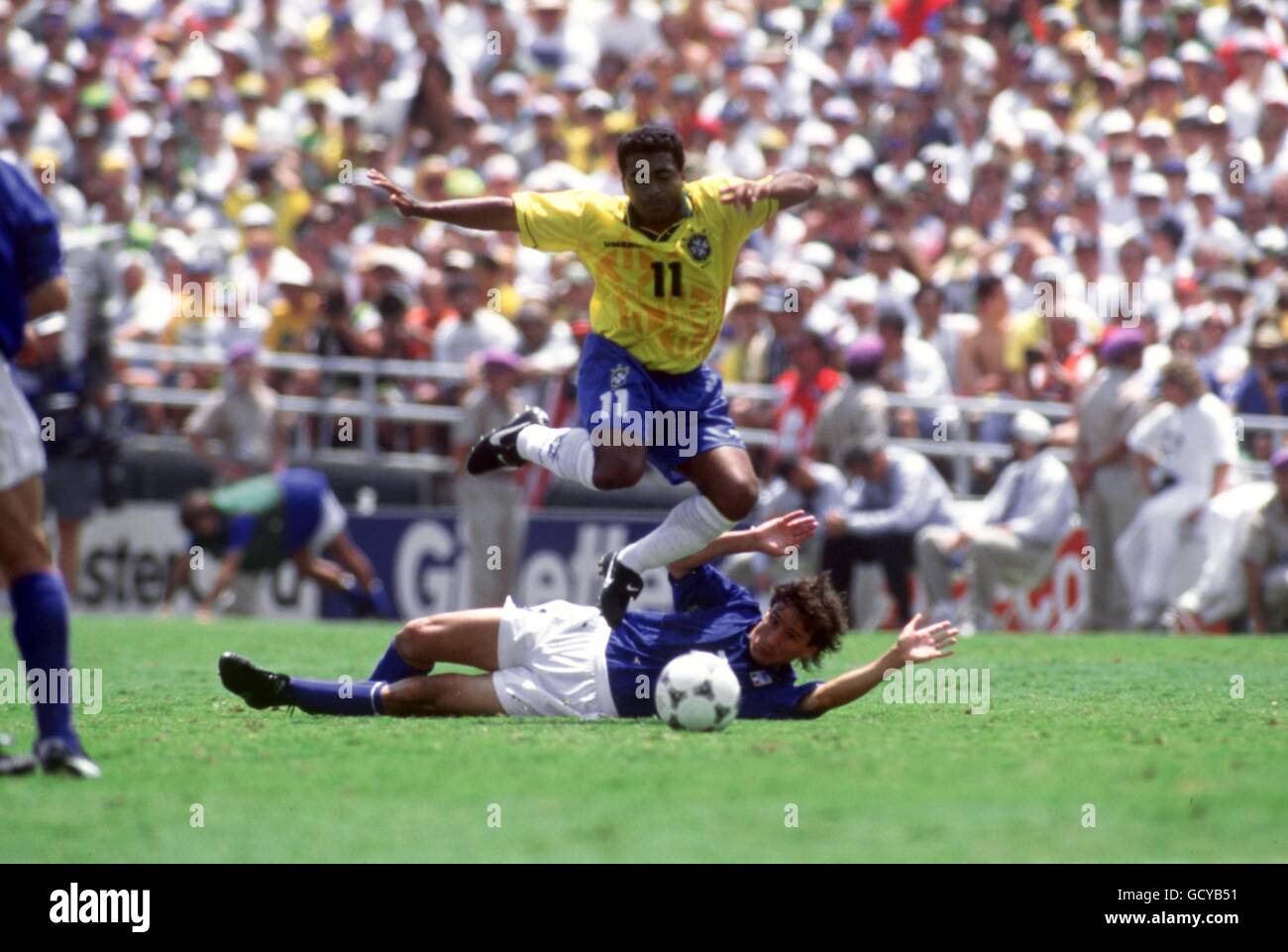 Soccer - 1994 FIFA World Cup - Final - Brazil v Italy - Rose Bowl, Pasadena. Romarid Brazil leaps over Antonio Benarrivo Italy Stock Photo