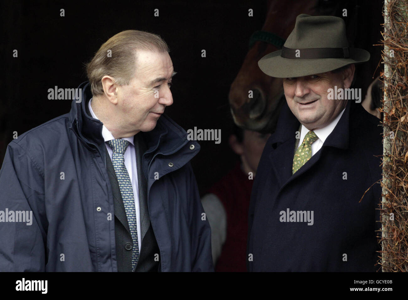 Race horse trainers Dermot Weld (left) and Noel Meade during the Bord na Mona Day of the Christmas Festival at Leopardstown Racecourse, Dublin, Ireland. Stock Photo