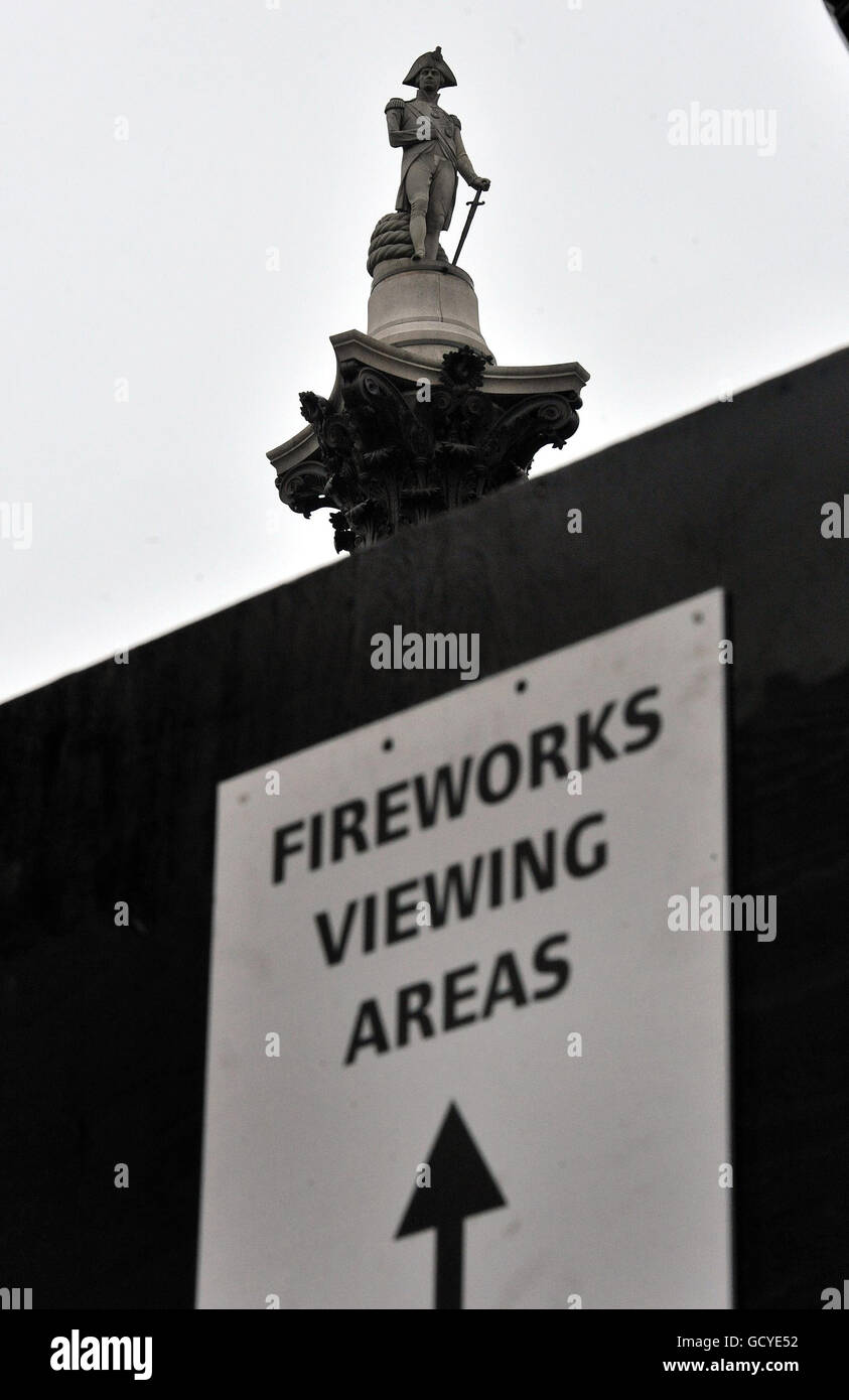 An ornate lamp post is surrounded by a wooden box, to protect it from the general public, who are expected to see-in the new year in Trafalgar Square central London, this evening. Stock Photo