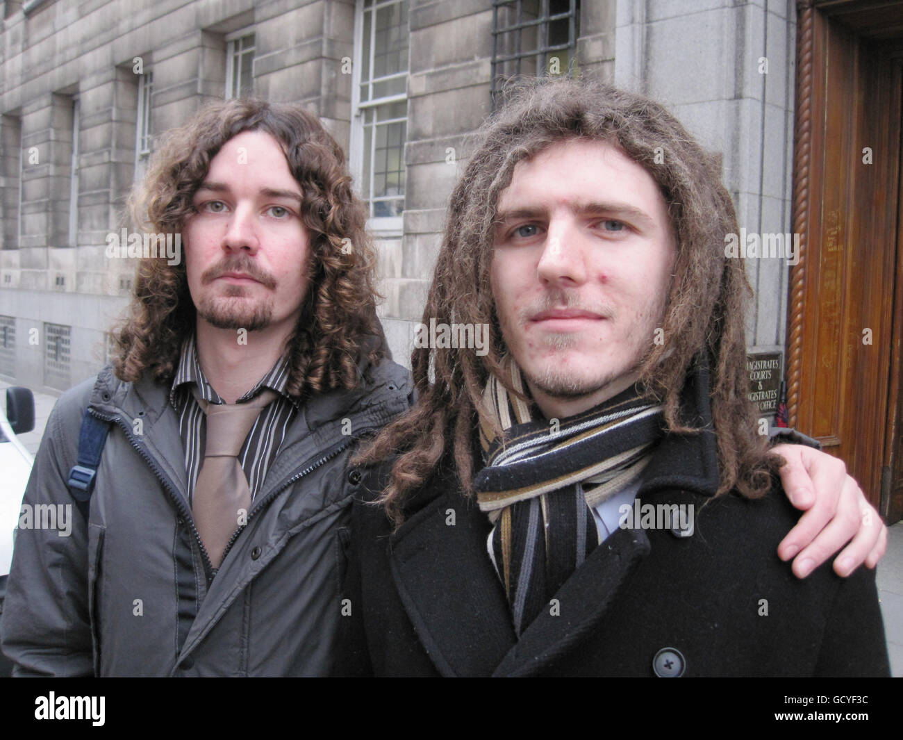 Political activists Mark Pearson (left)and Patrick Reay outside Newcastle Magistrates Court where Pearson denied a breach of the Public Order Act of 1986 and Reay, denied charges of obstructing a police officer who was arresting Pearson, following demonstrations in Newcastle in which hundreds of people protested over Government plans to raise university tuition fees. Stock Photo