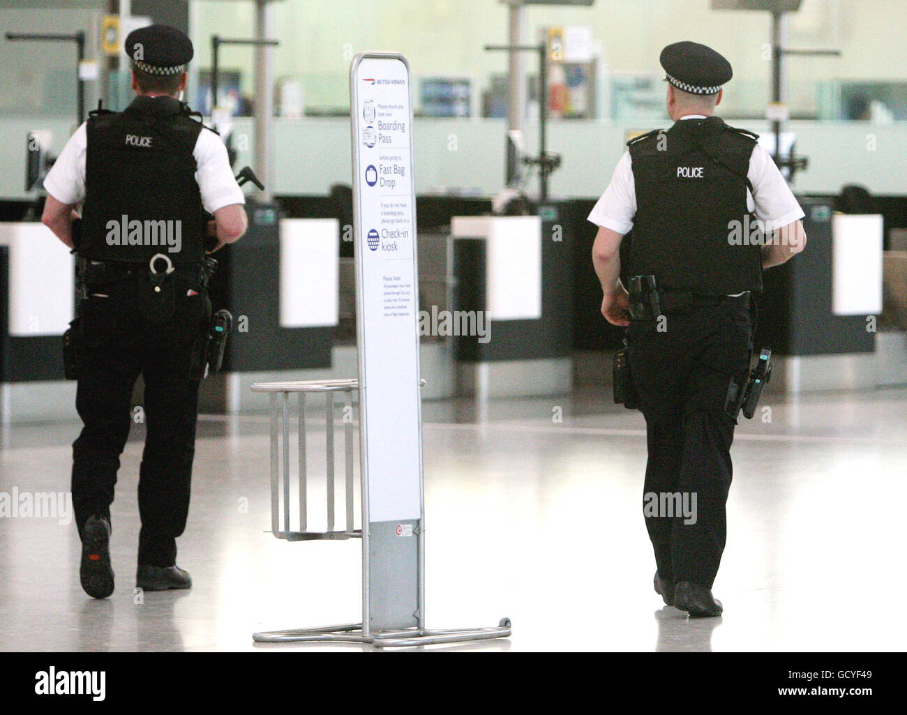 Armed police officers on patrol at heathrow airports terminal 5 hires