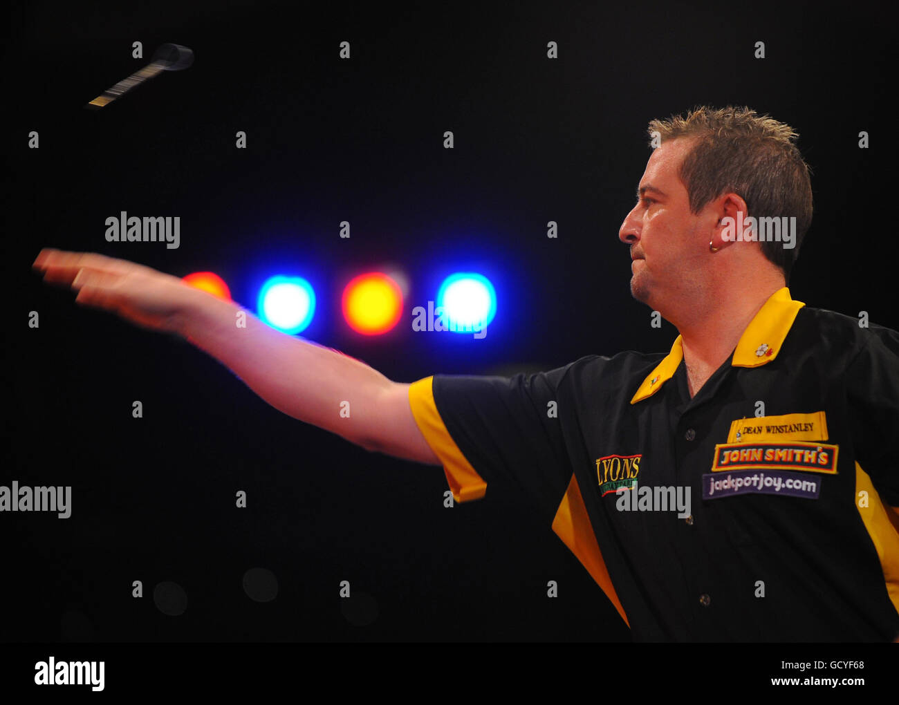 England's Dean Winstanley in action against England's Stephen Bunting during the BDO World Professional Darts Championship at the Lakeside Complex, Surrey. Stock Photo