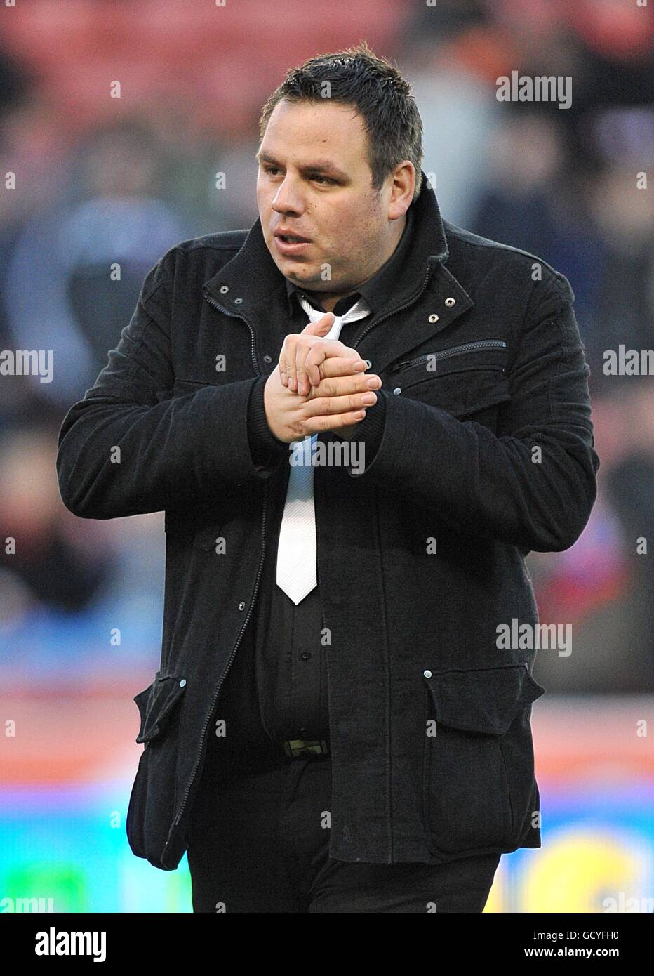 PDC World Darts Champion Adrian Lewis on the pitch at the Britannia Stadium during the half time interval Stock Photo