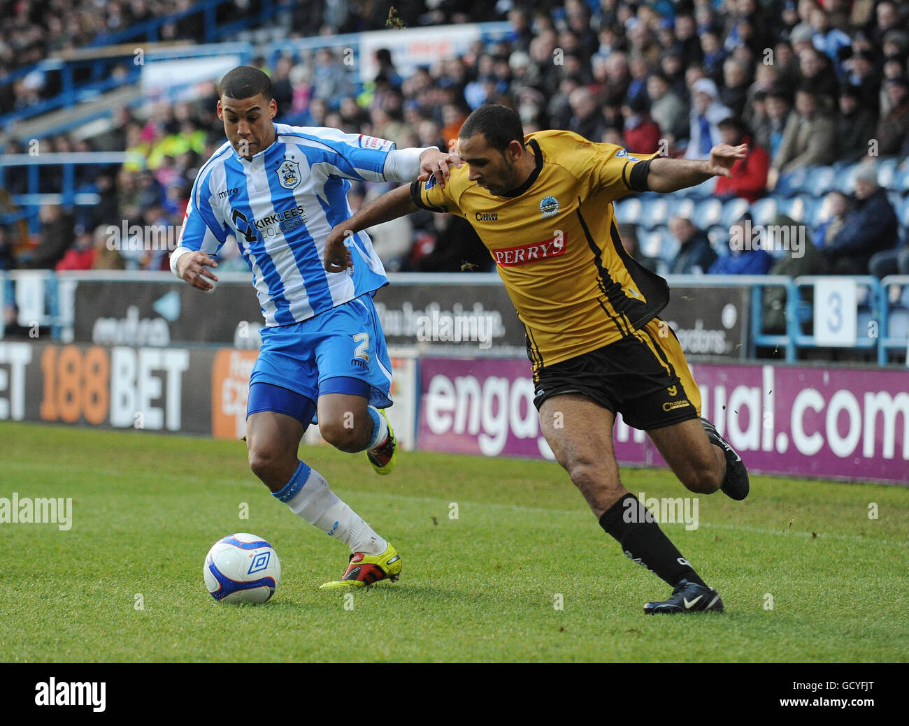 Huddersfield Town's Lee Peltier (left) and Dover Athletic's Ben Hunt