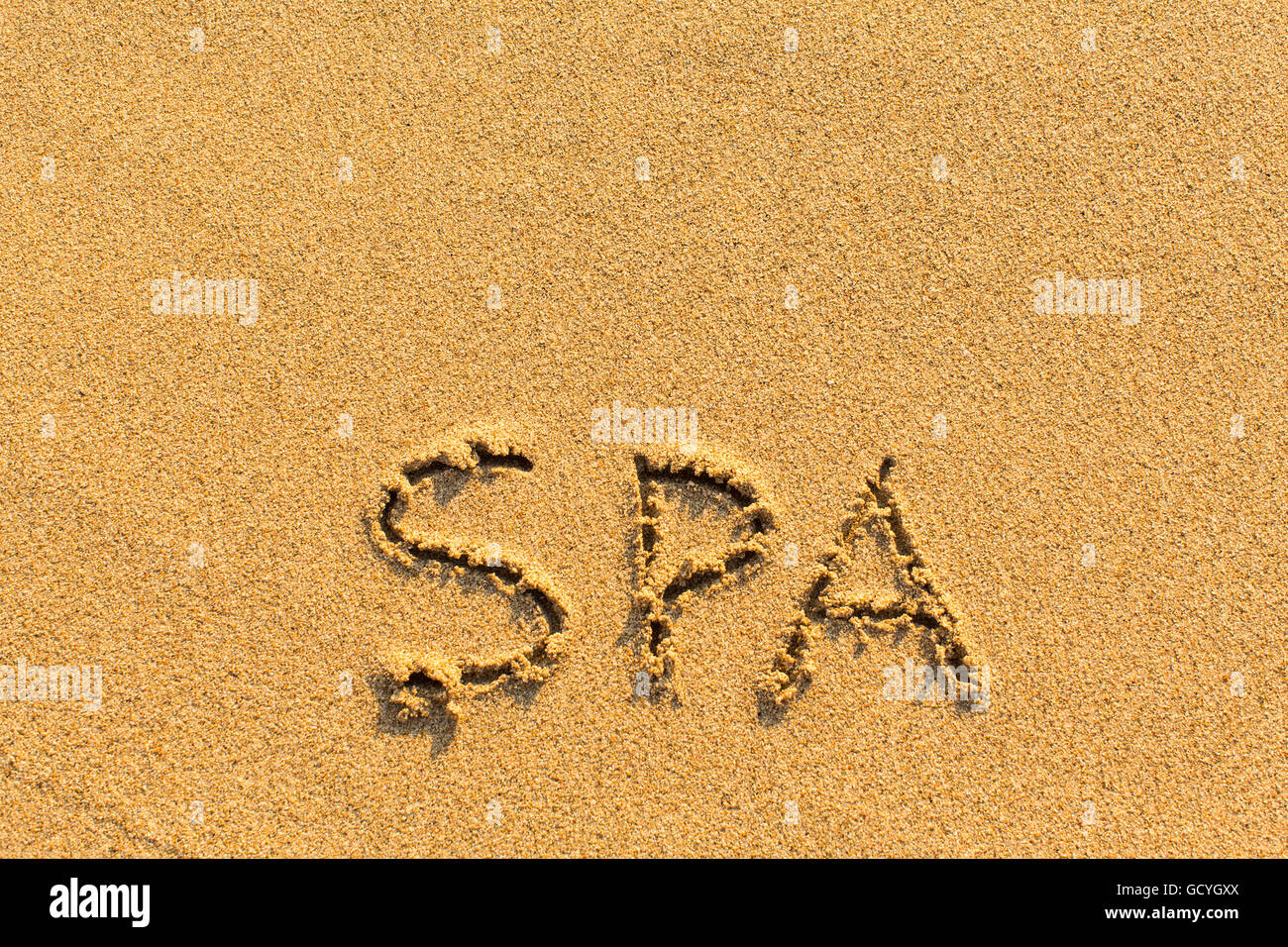 Spa - inscription by hand on a sandy golden sea beach Stock Photo - Alamy