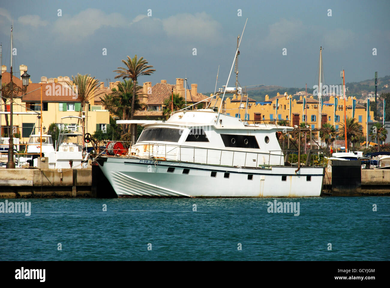 Yachts and boats in the marina with buildings to the rear, Puerto
