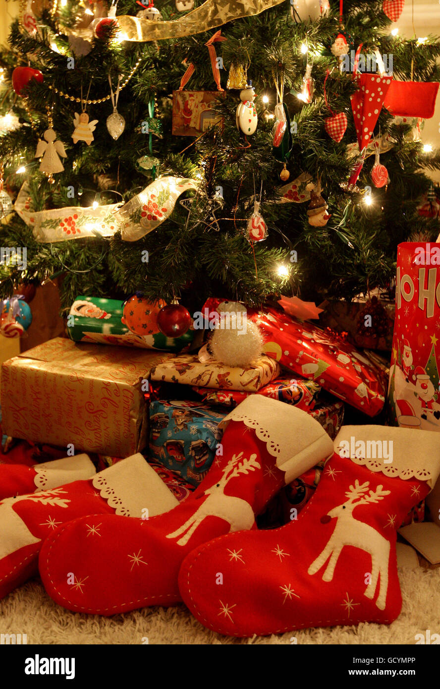 Presents under a Christmas Tree decorated with decorations Stock Photo ...