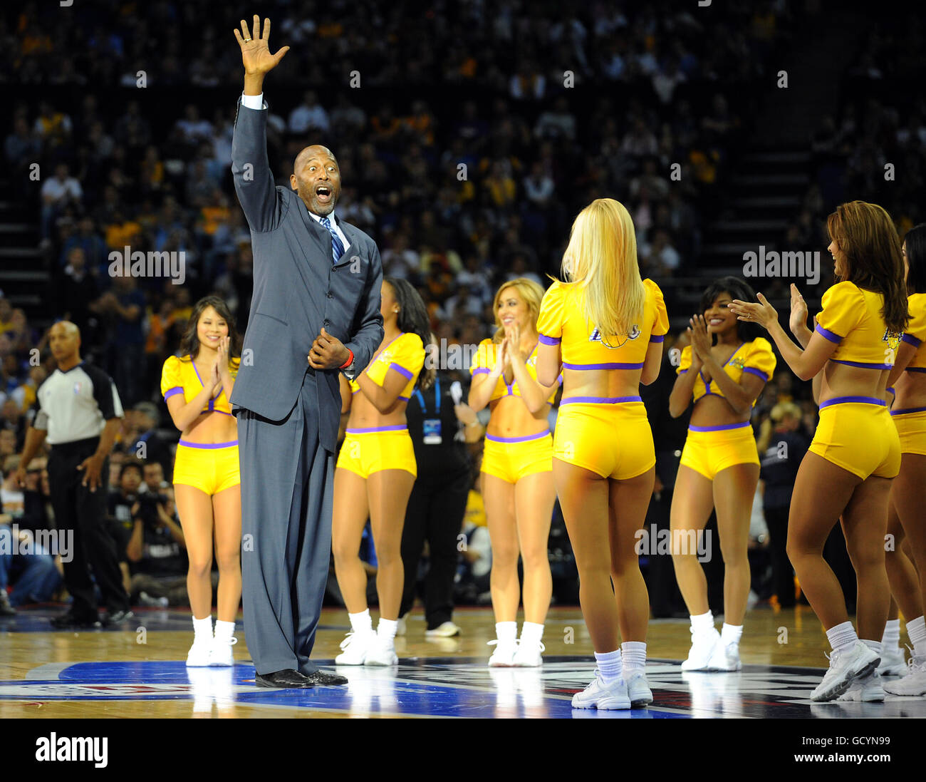 Basketball - NBA - Pre-Season Tour - Minnesota Timberwolves v LA Lakers - O2 Arena. LA Lakers retired hall of fame member James Worthy waves to fans during the half-time show Stock Photo