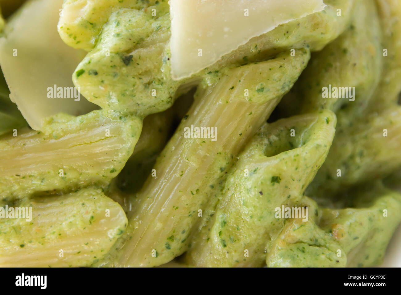 Spring penne with spinach pesto and green pea Stock Photo