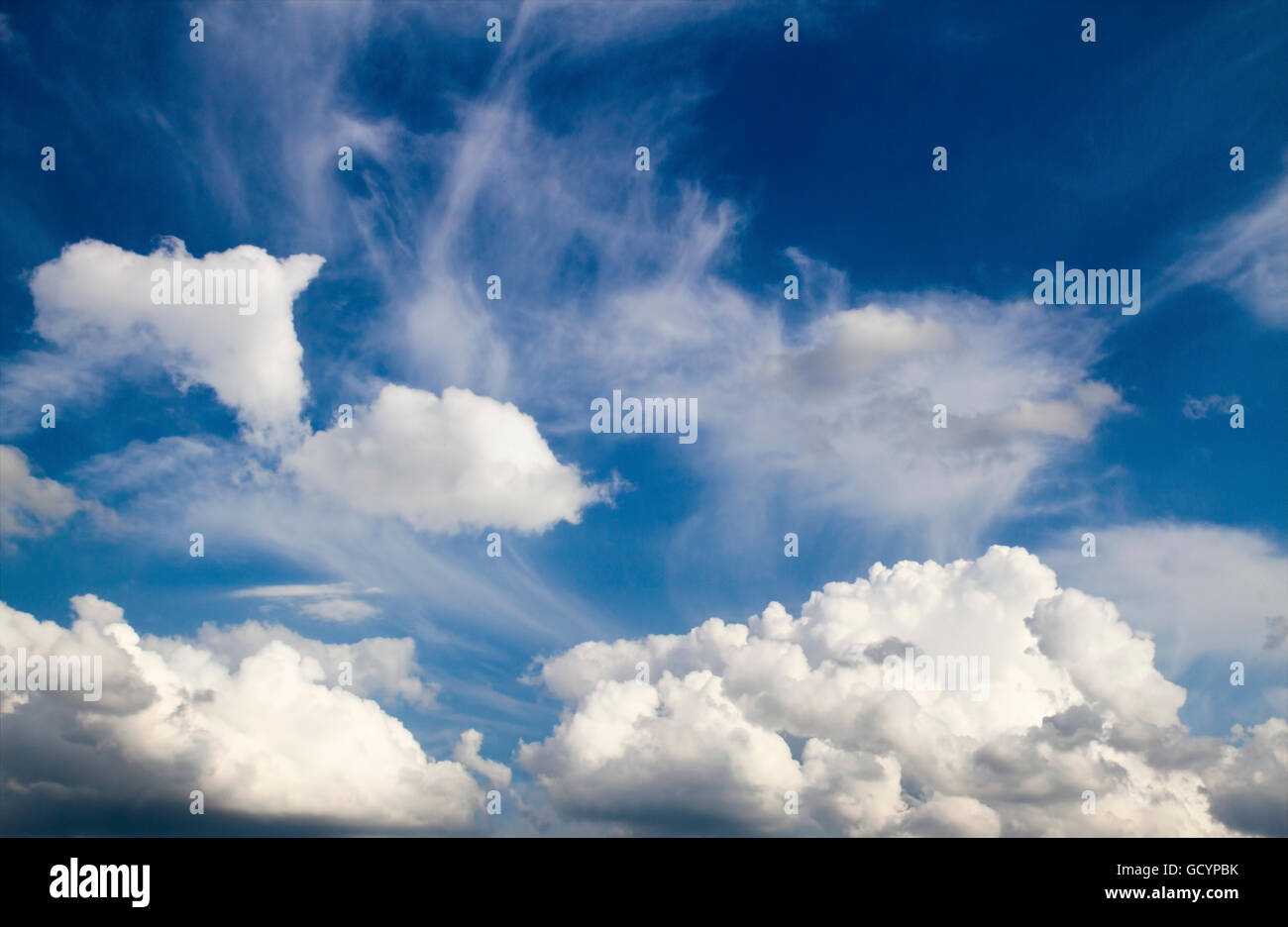 Blue sky with cumulus white clouds background Stock Photo - Alamy