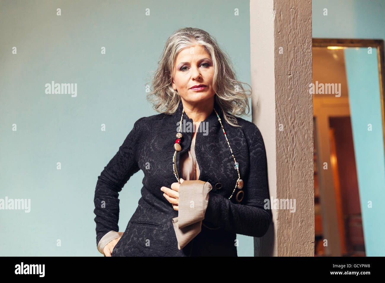 Elegant woman in interior Stock Photo - Alamy