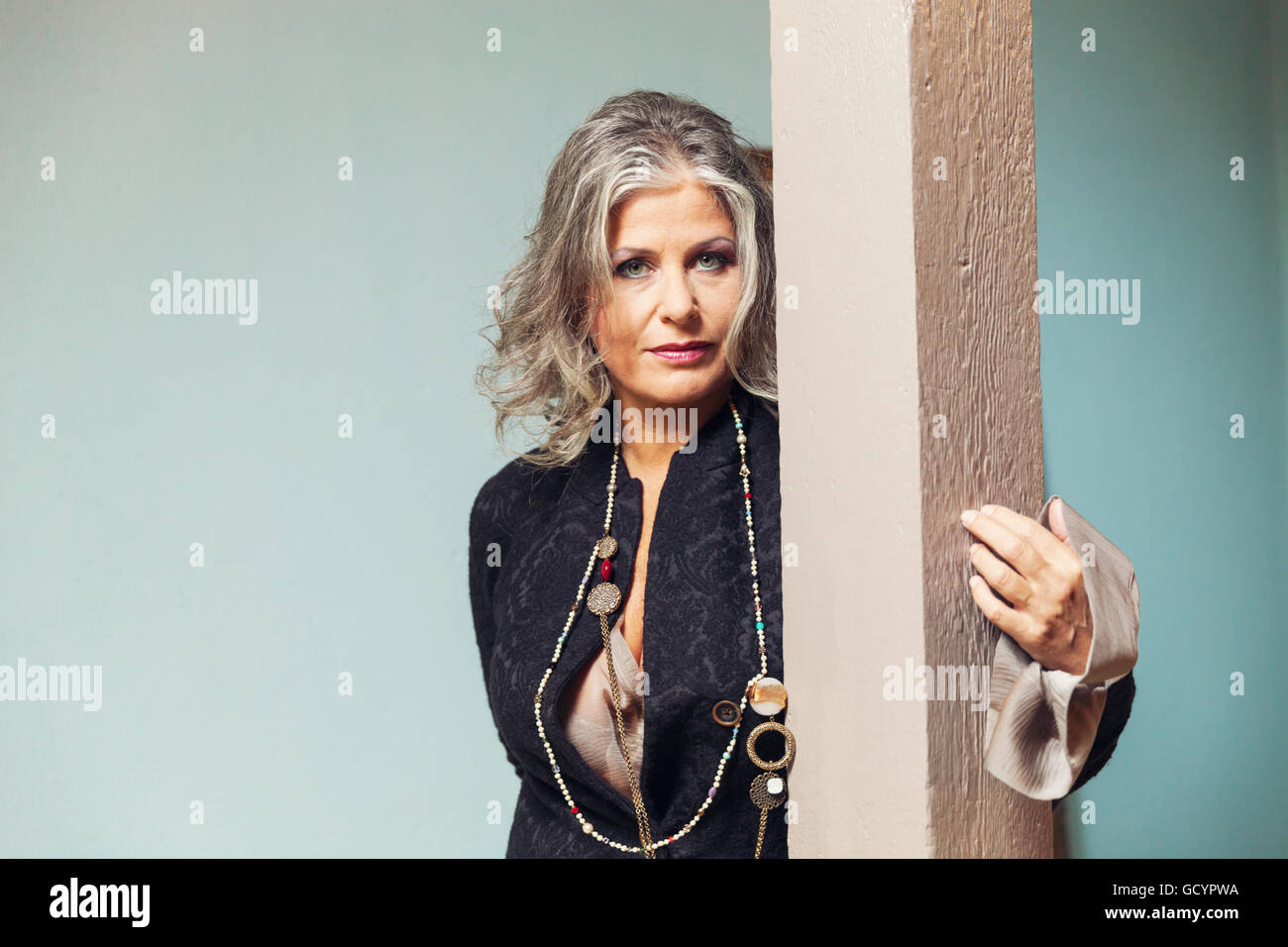 Elegant woman in interior Stock Photo - Alamy