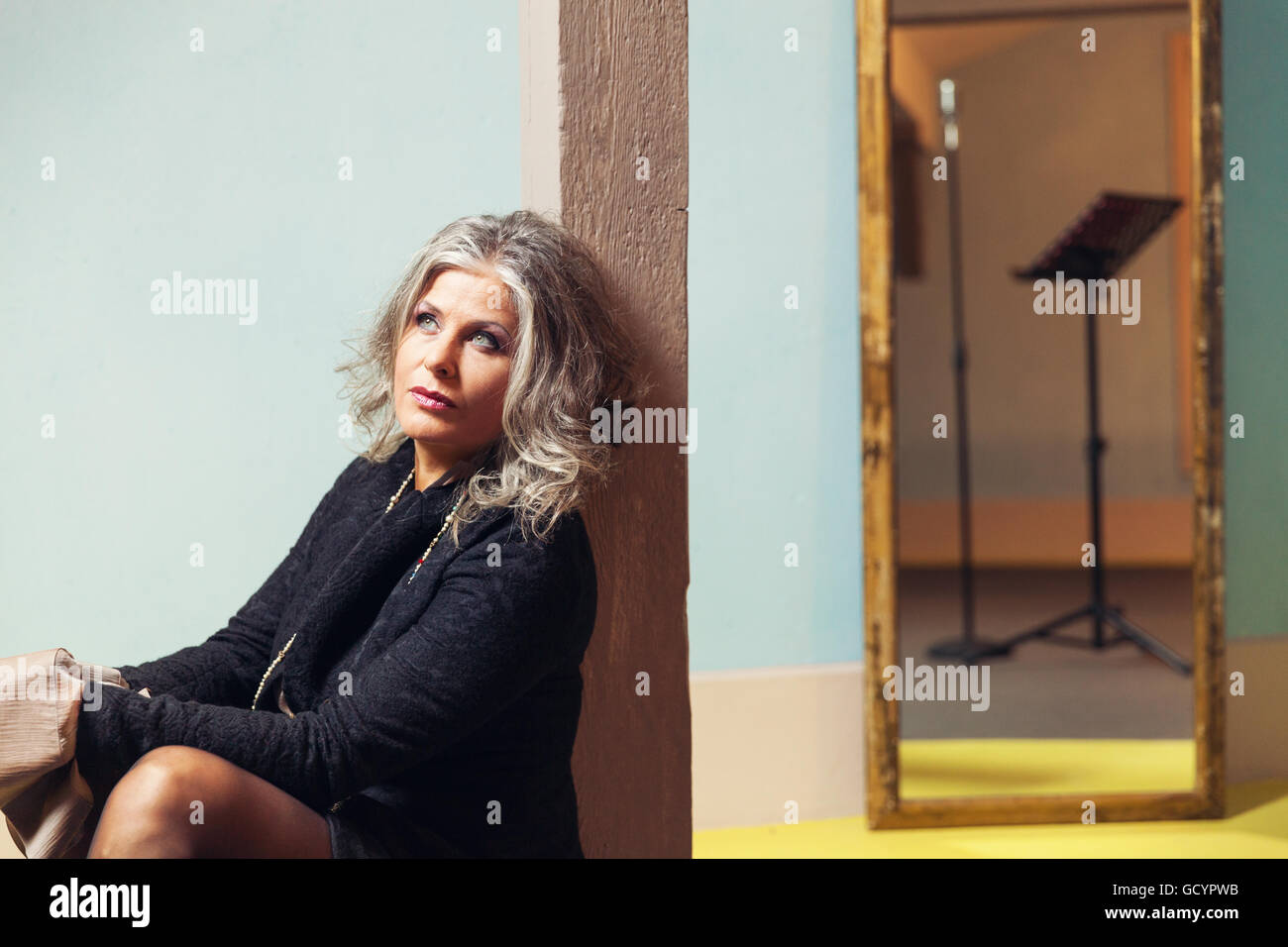 Elegant woman in interior Stock Photo - Alamy
