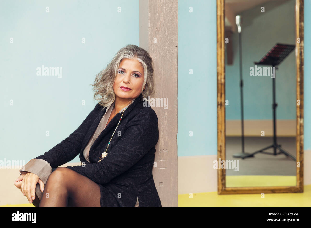 Elegant woman in interior Stock Photo - Alamy