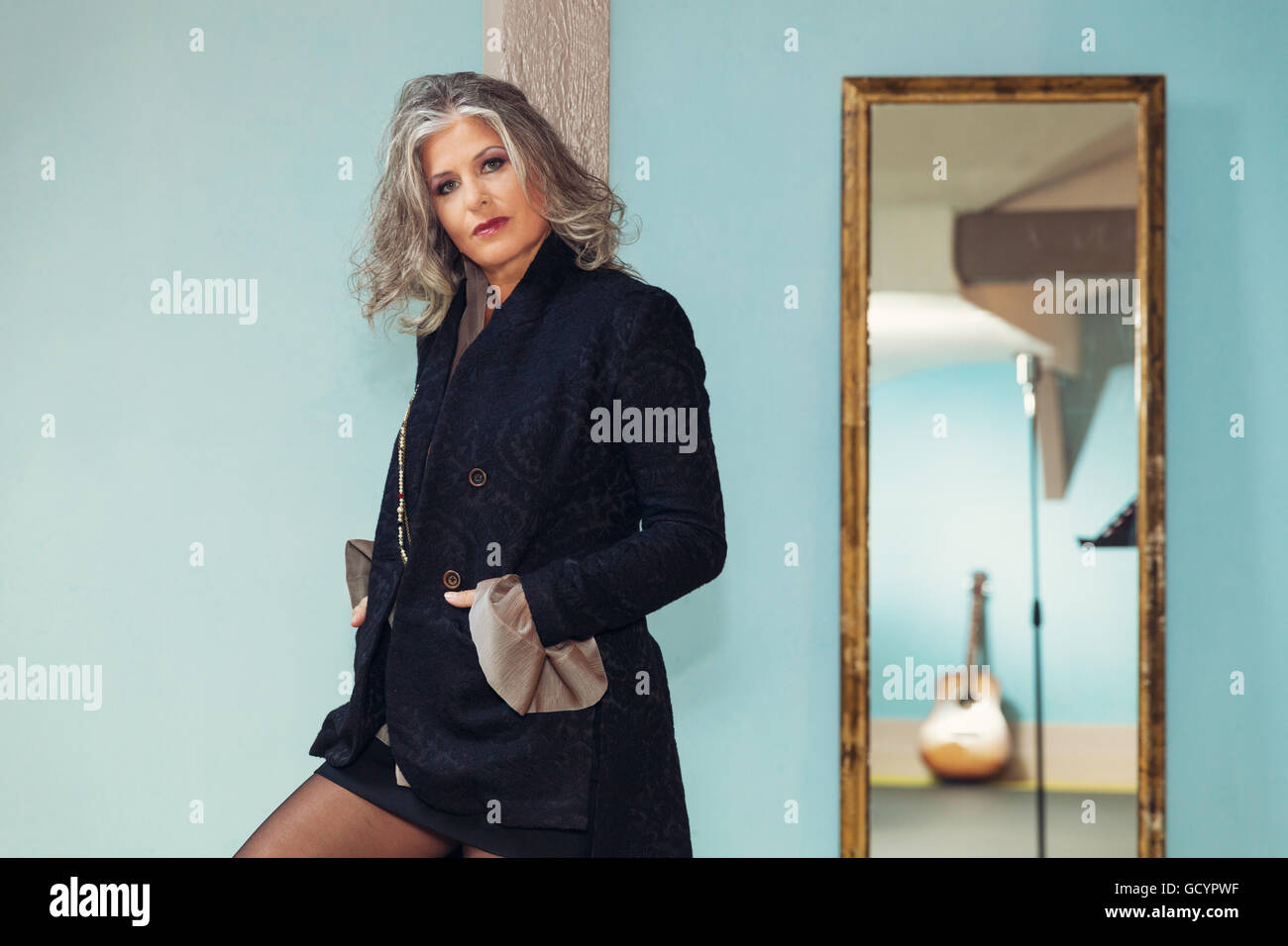 Elegant woman in interior Stock Photo - Alamy