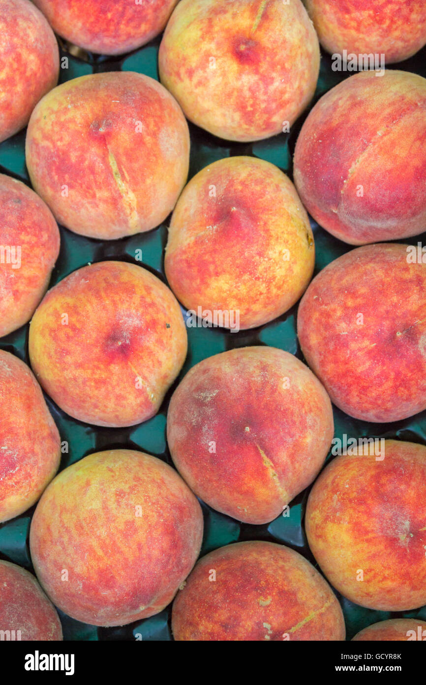 Delicious ripe peaches in the market on the counter Stock Photo - Alamy