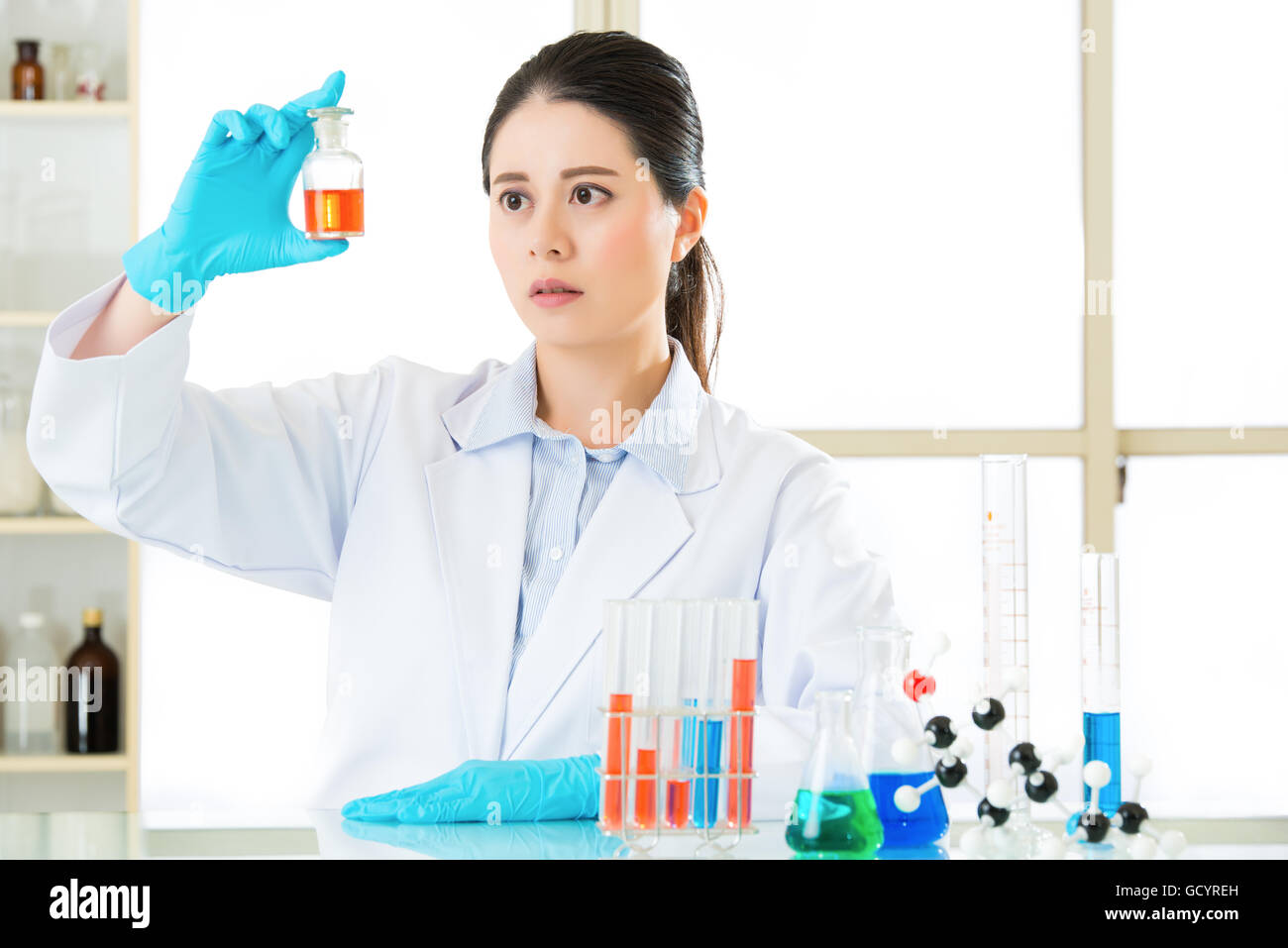 Beautiful Asian female biologist Braving new medical frontiers in laboratory Stock Photo