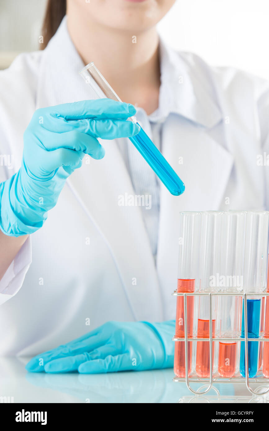asian female scientist pipetting in life science laboratoryt in laboratory Stock Photo