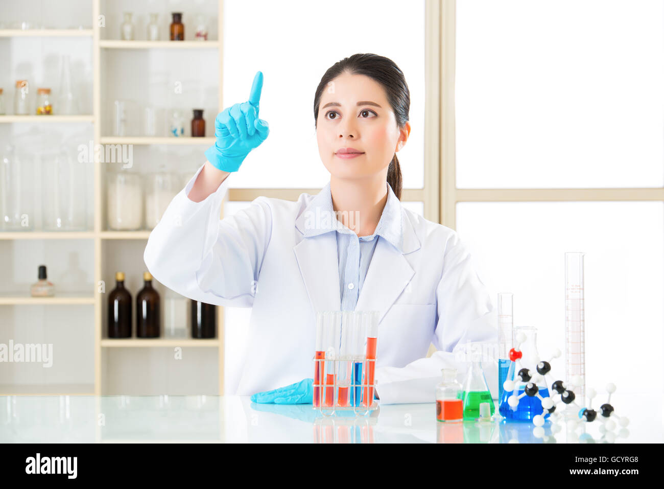 professional asian scientist hoping for some conclusive results Stock Photo