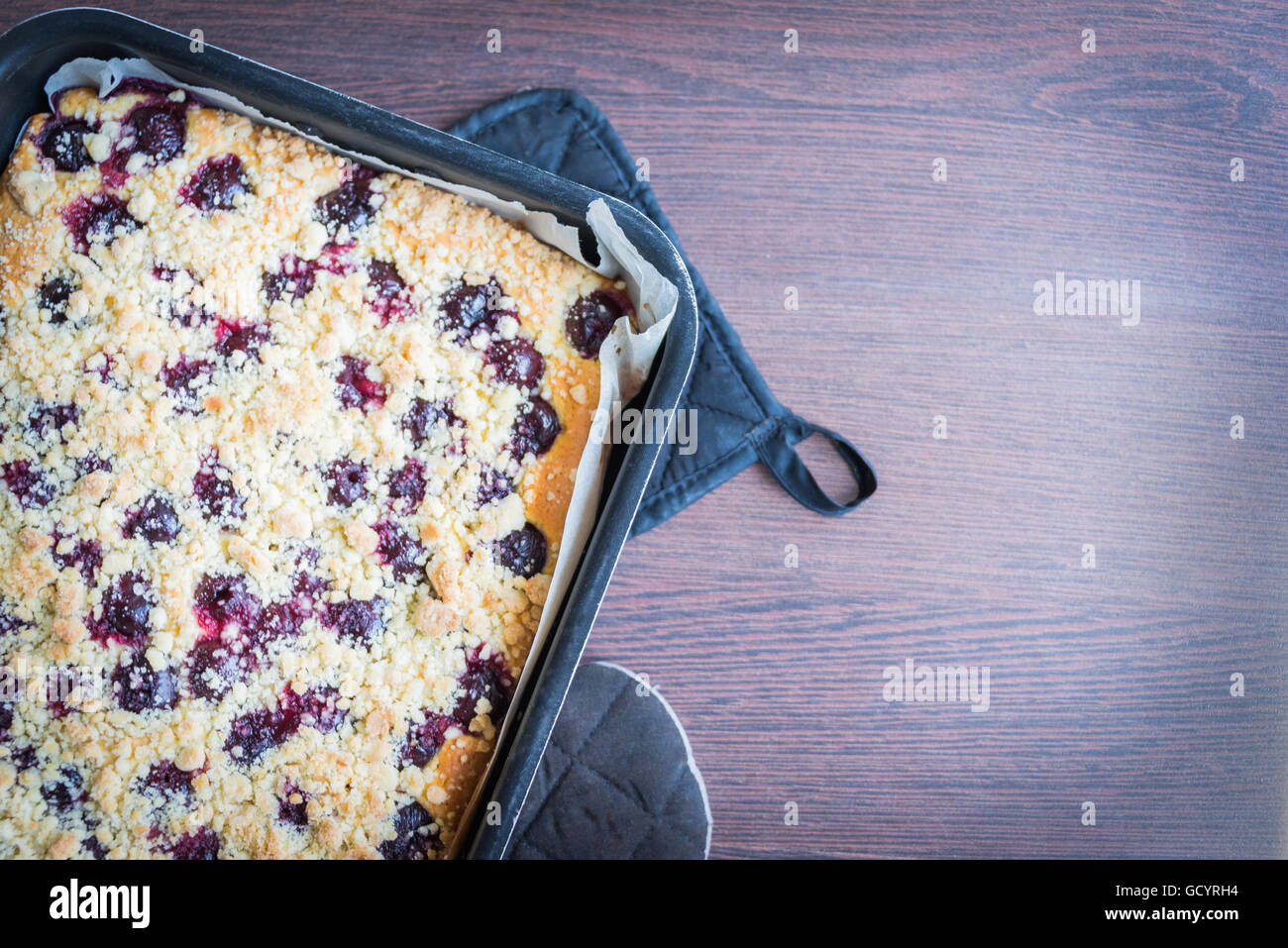 Home made butter cherry cake with crumble topping Stock Photo