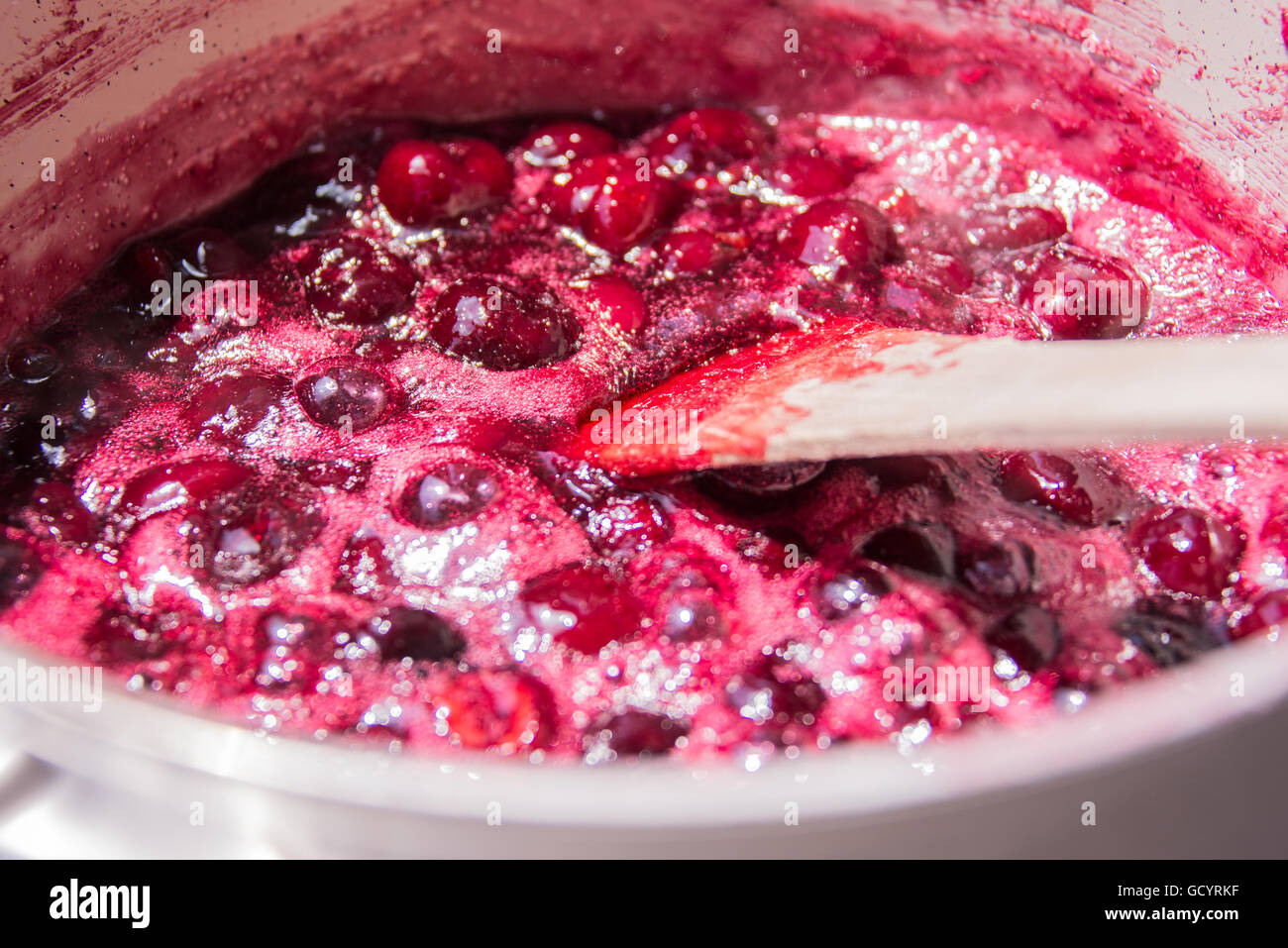 Close up of simmering homemade cherry jam Stock Photo