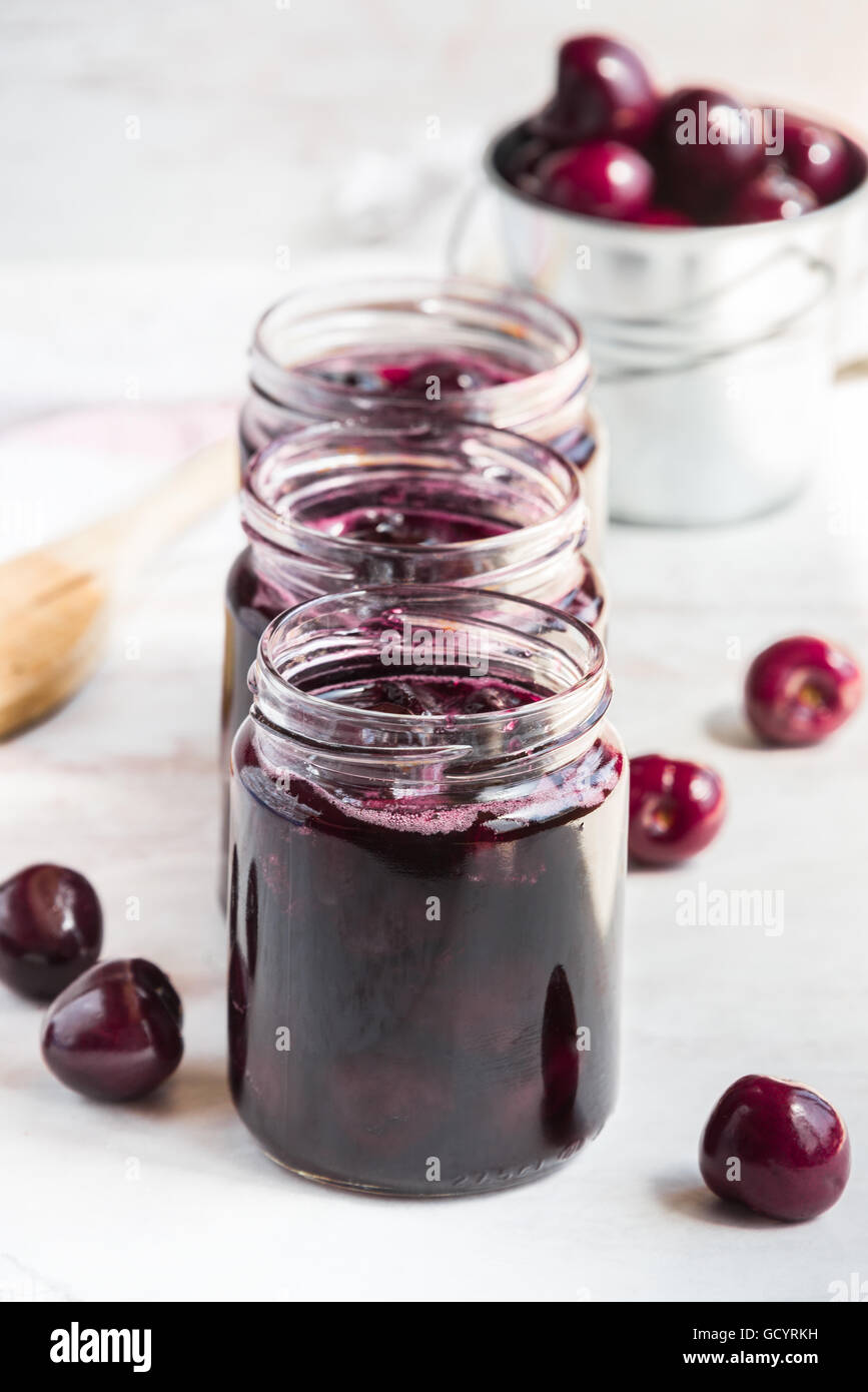 Jars with freshly homemade cherry jam Stock Photo