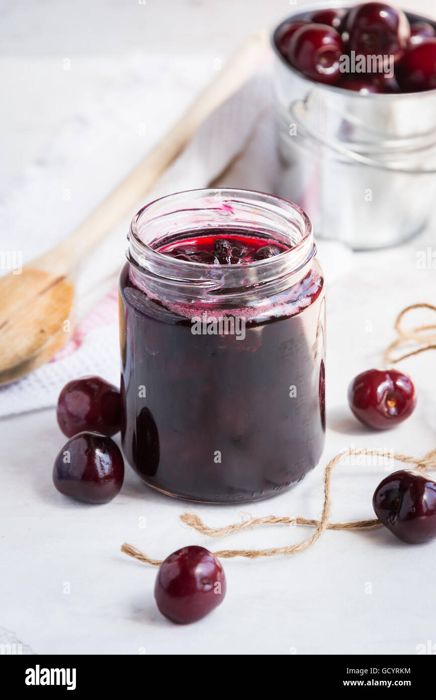 Jar with freshly homemade cherry jam Stock Photo