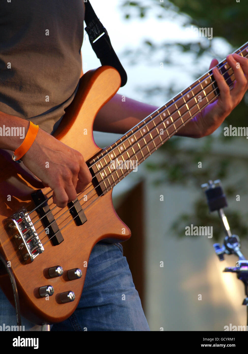 Bass player performing on a stage Stock Photo