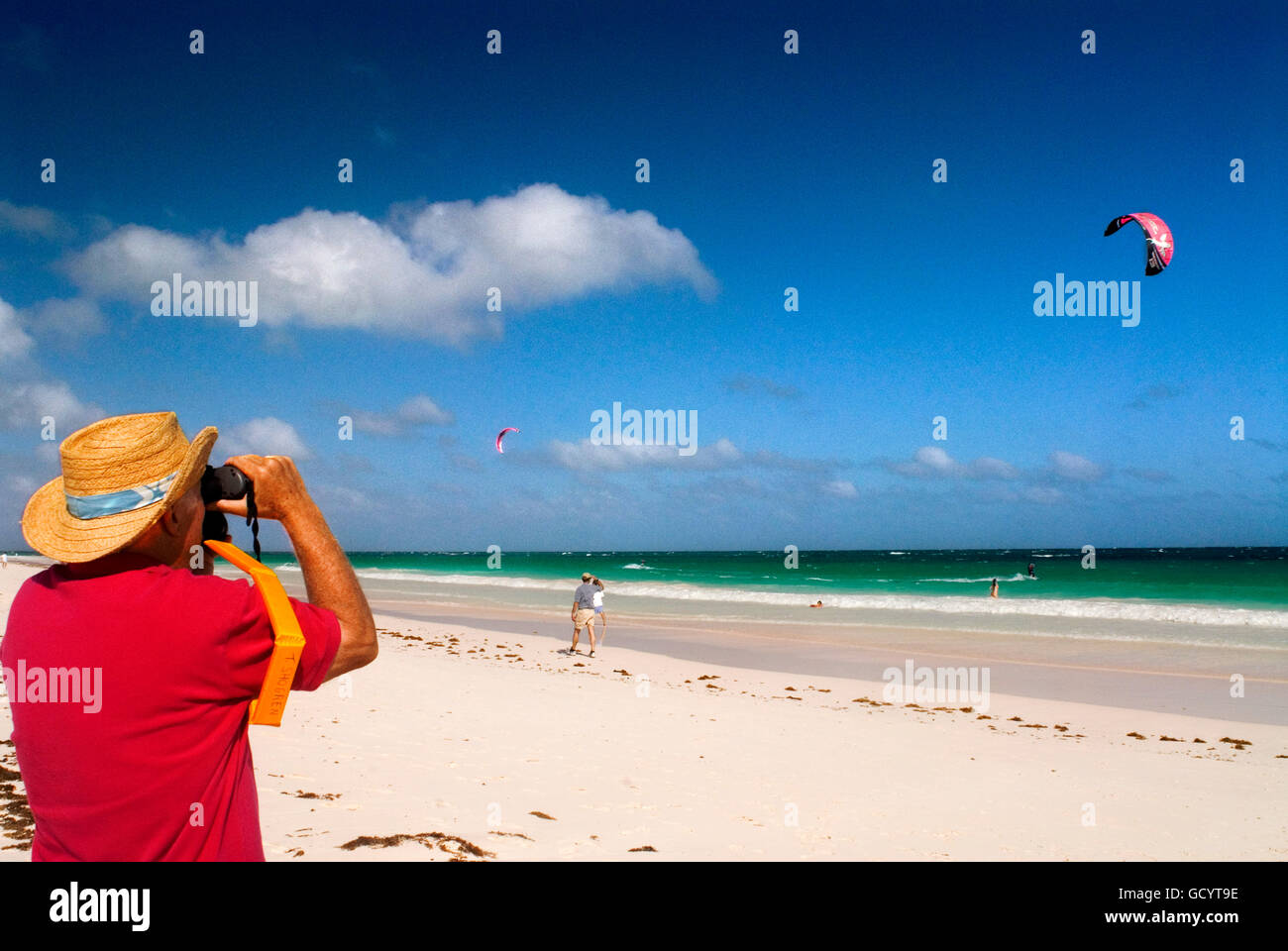 Tourist at Pink Sand Beach. Dunmore Town, Harbour Island, Eleuthera. Bahamas Stock Photo