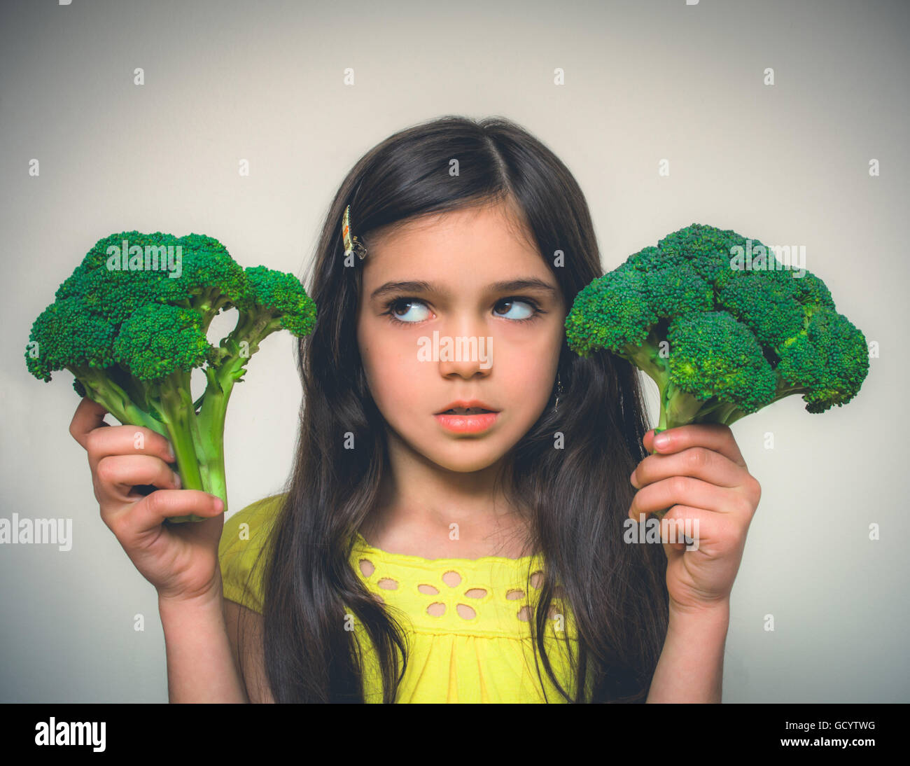 Young girl with brown hair acting Stock Photo - Alamy