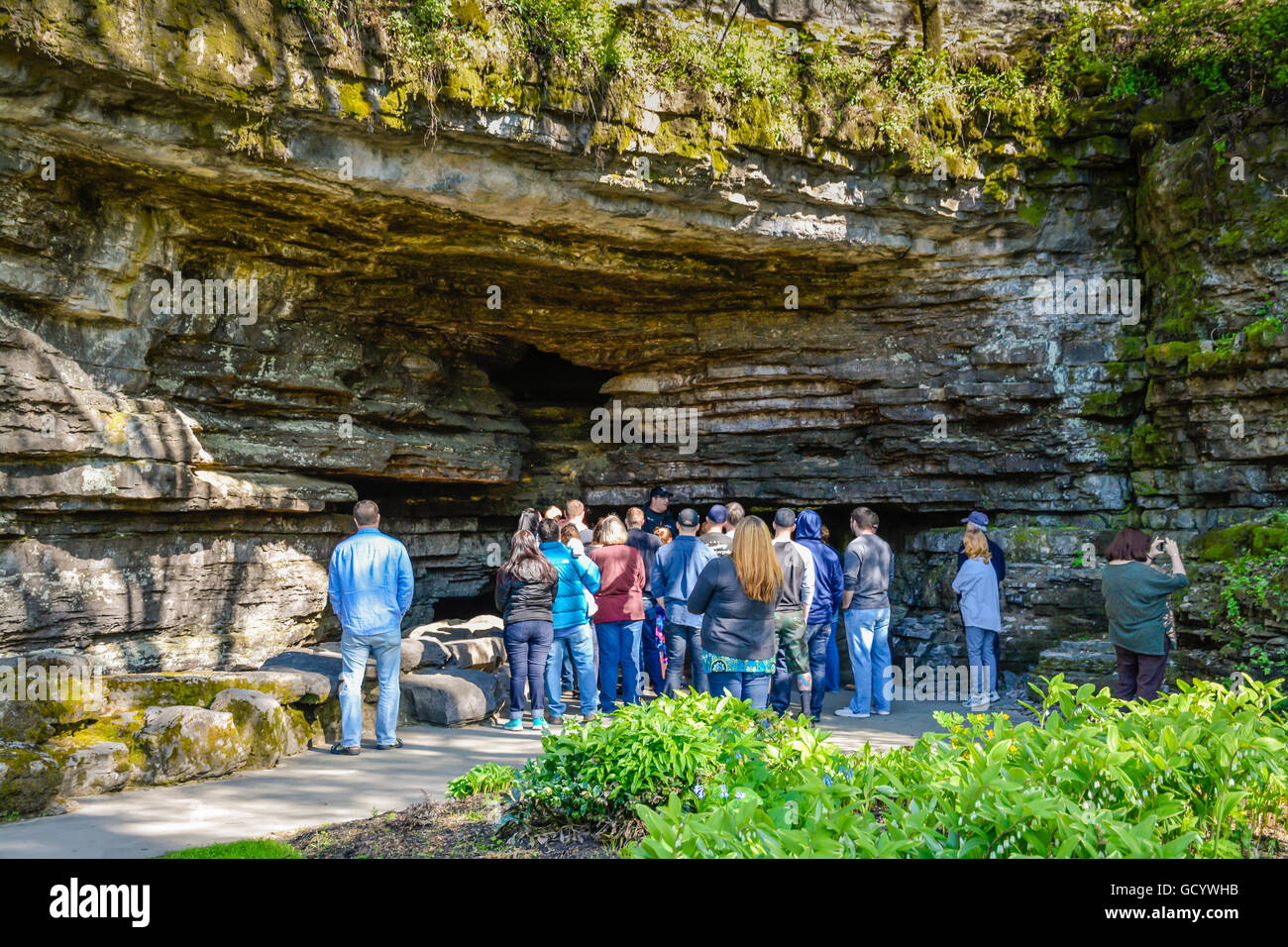 People on guided tour of Jack Daniel's Distillery grounds' location site of Cave Spring water in Lynchburg, TN Stock Photo