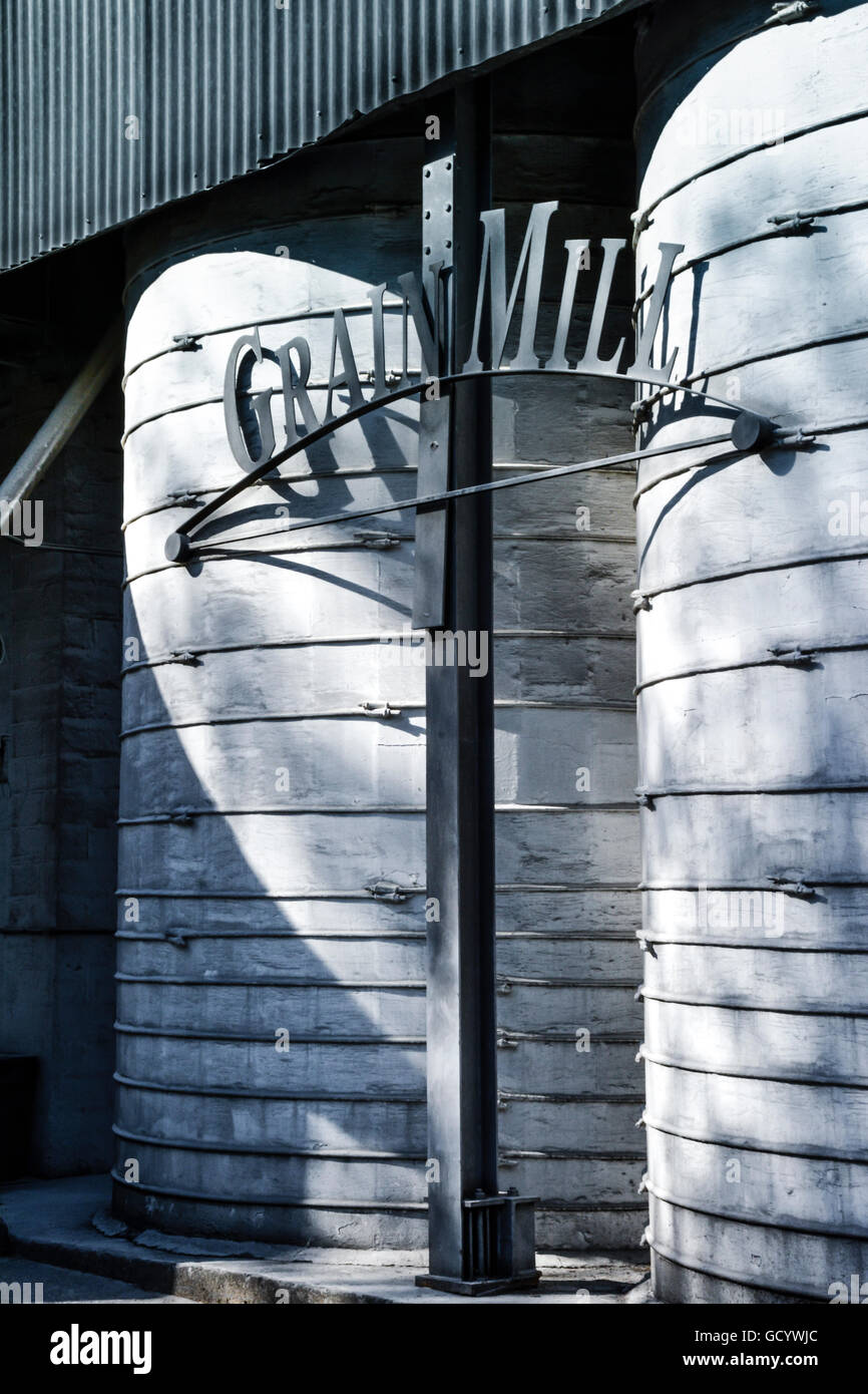 Old metal grain mill structures seem abstract on the grounds of Jacks