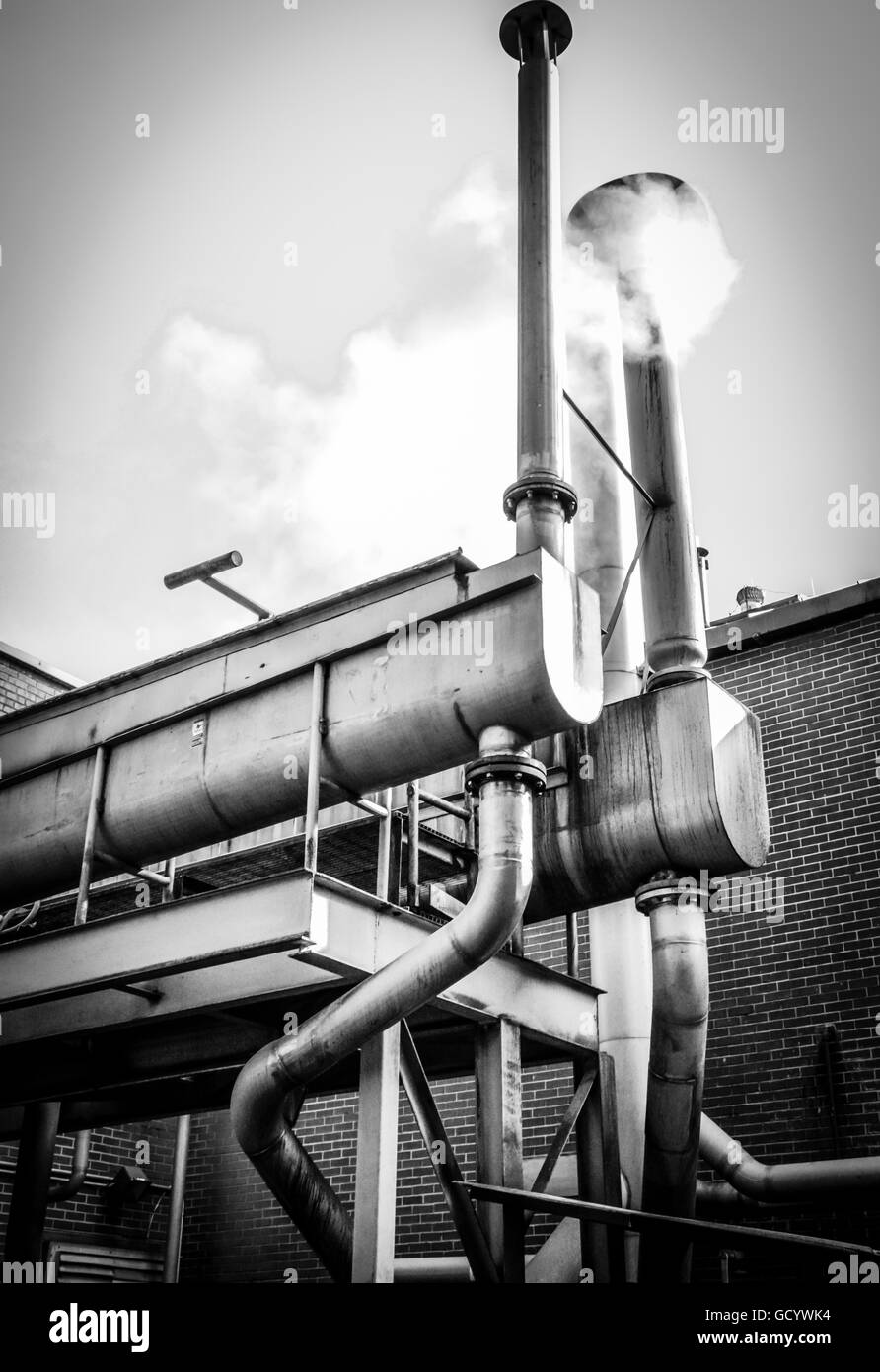 White steam rises around the processing facilities at the Jack Daniel's whiskey distillery site in Lynchburg, TN Stock Photo