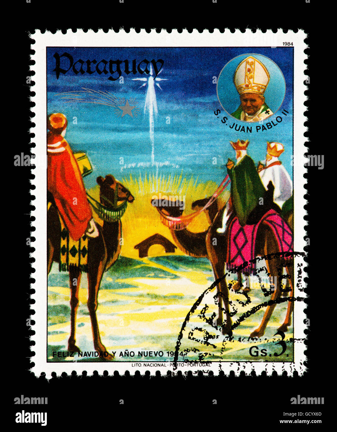 Postage stamp from Paraguay depicting the three wise men following a star to see Jesus. Stock Photo