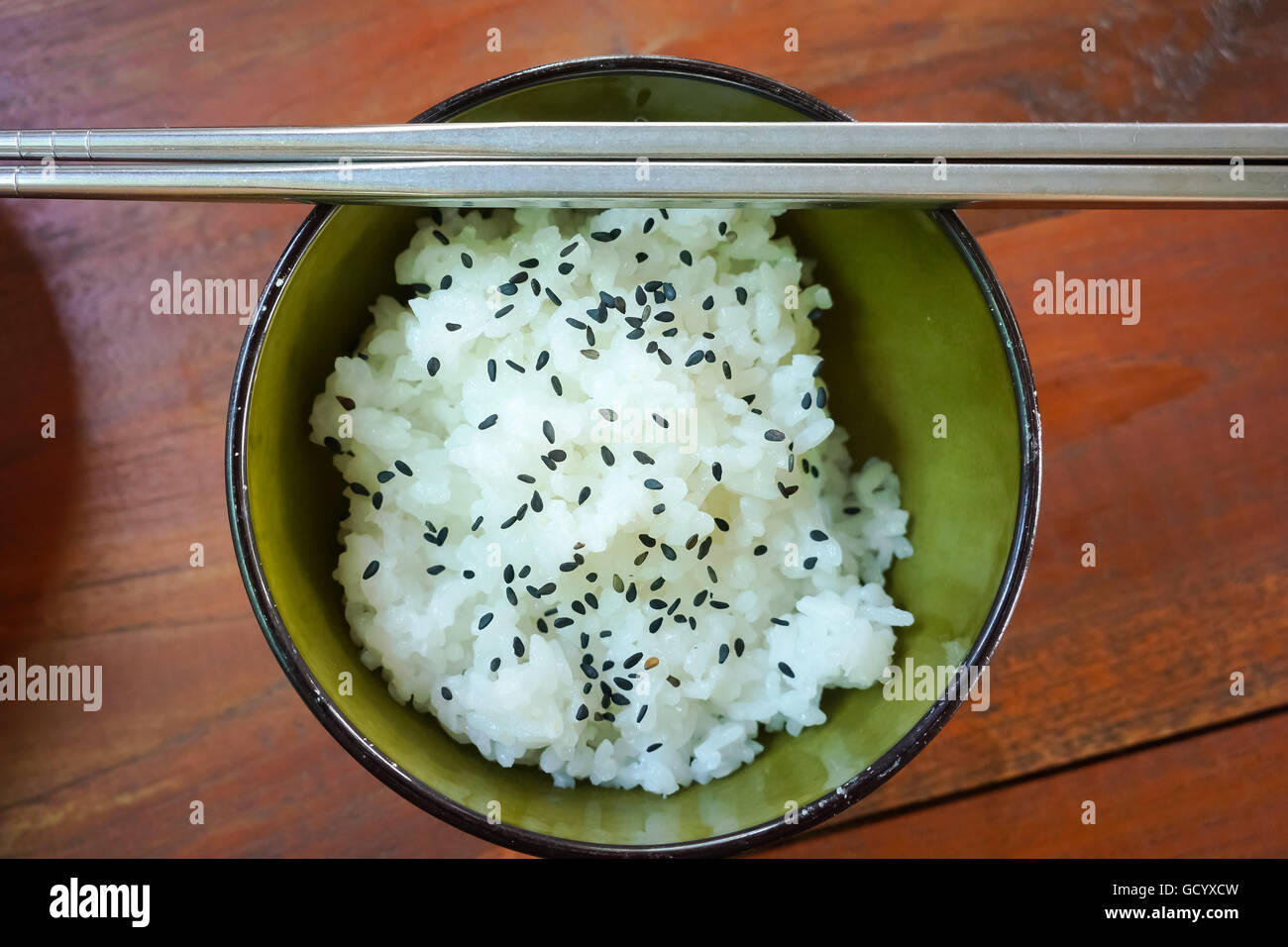 White Jasmine Rice in Asian Bowl with Black Sesame Seeds - Stock Image Stock Photo