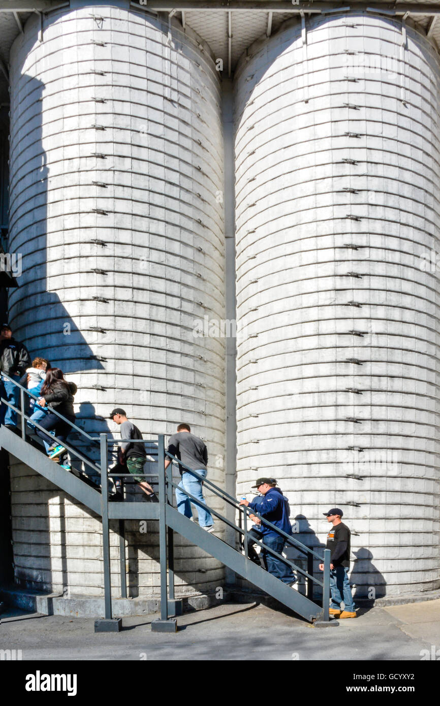 Abstract Jack Daniel's grain mills with tourists on stairs entering