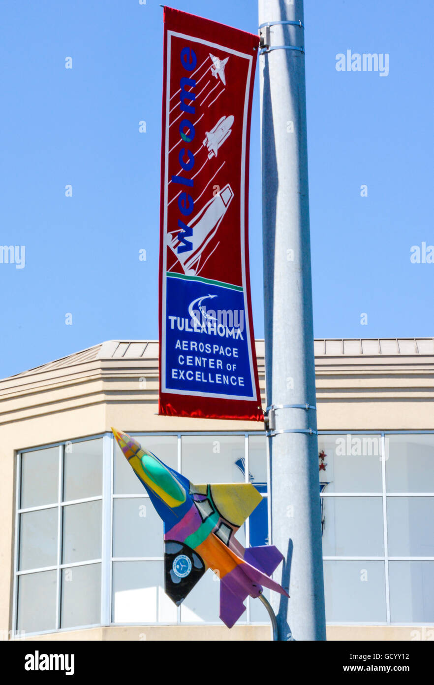 The City of Tullahoma's Aerospace Center of Excellence welcomes visitors with colorful sign & airplane on a street post in TN Stock Photo