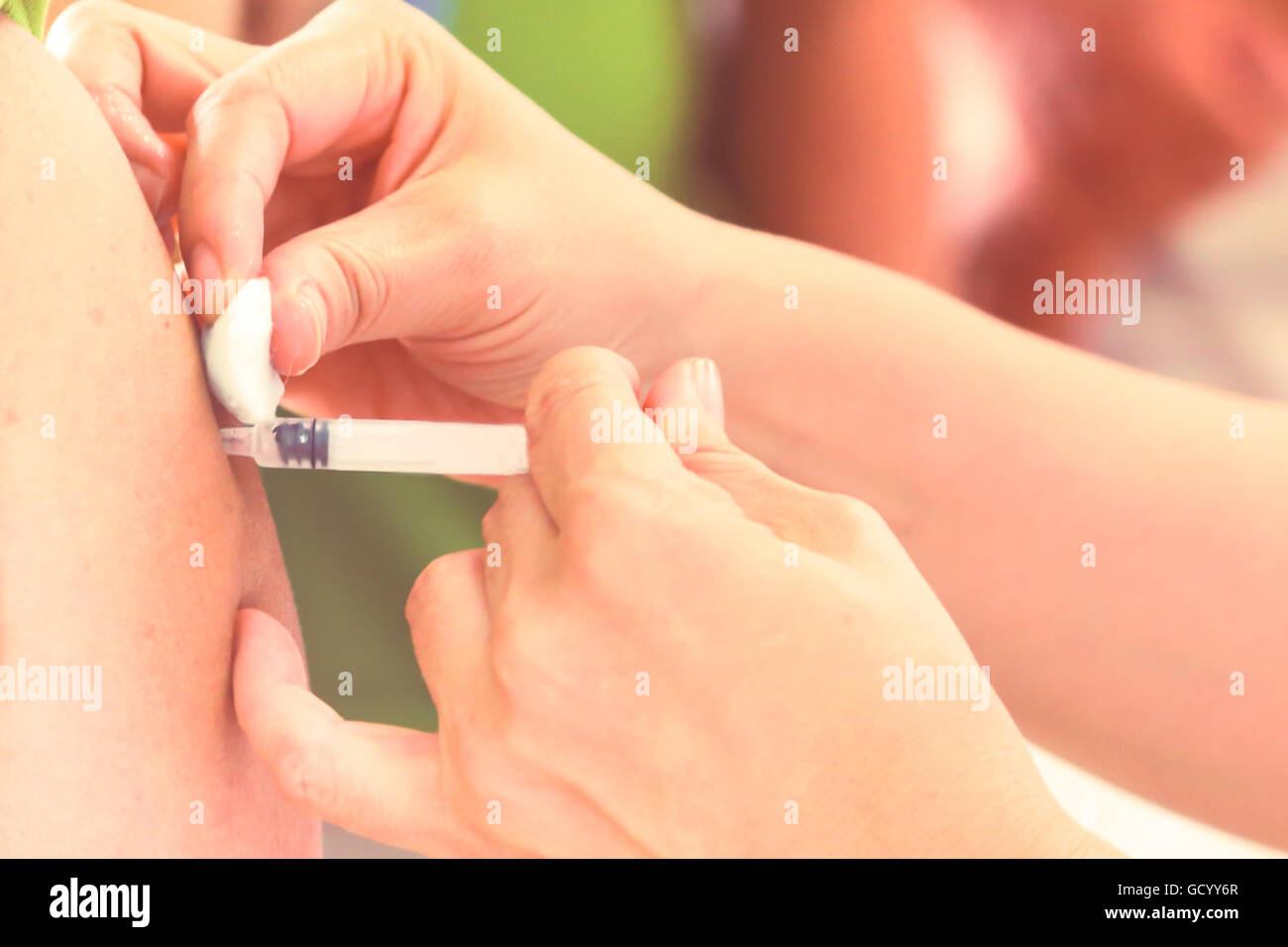 Shot of human hands making an injection with a syringe Stock Photo - Alamy