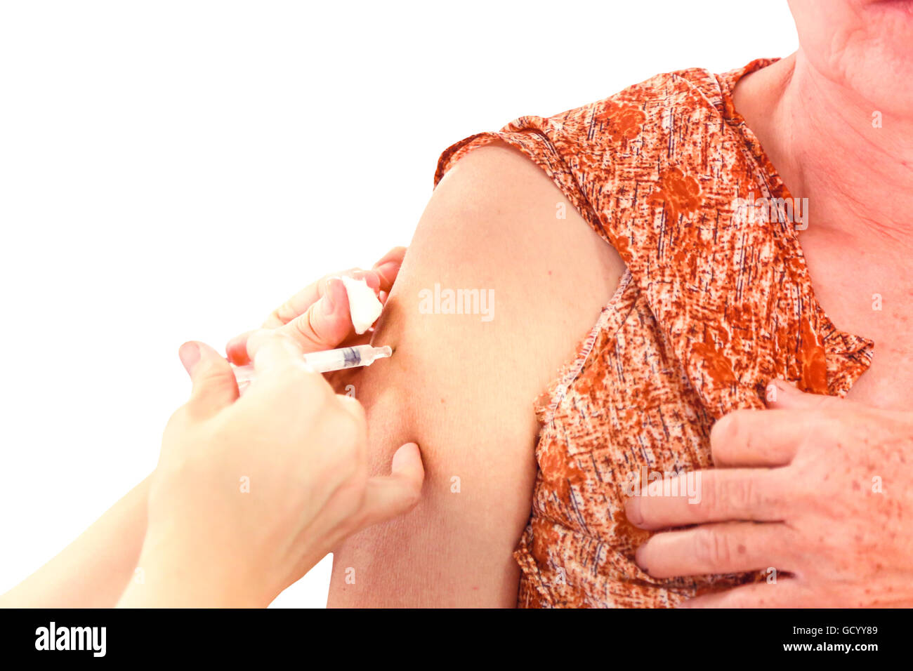 Shot of human hands making an injection with a syringe with isolate ...