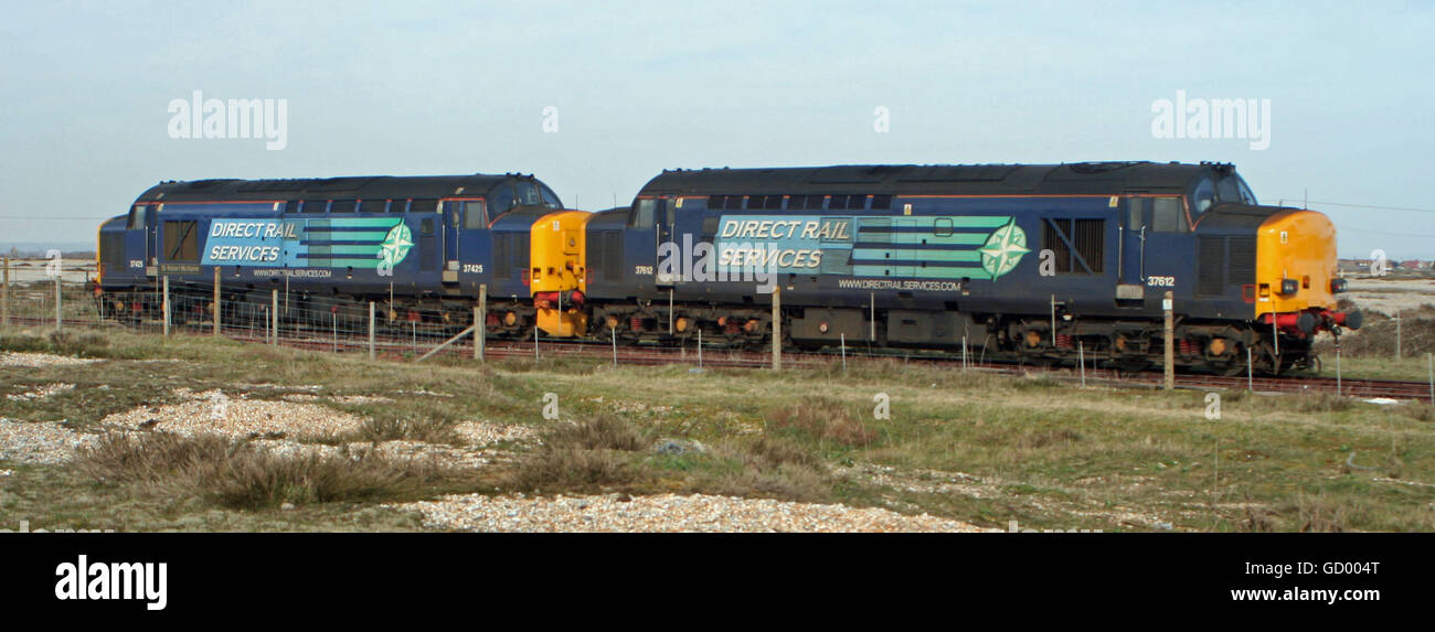 English Electric Class 37 Diesels wait to take a Nuclear Flask Train away from Dungeness Power Station Stock Photo