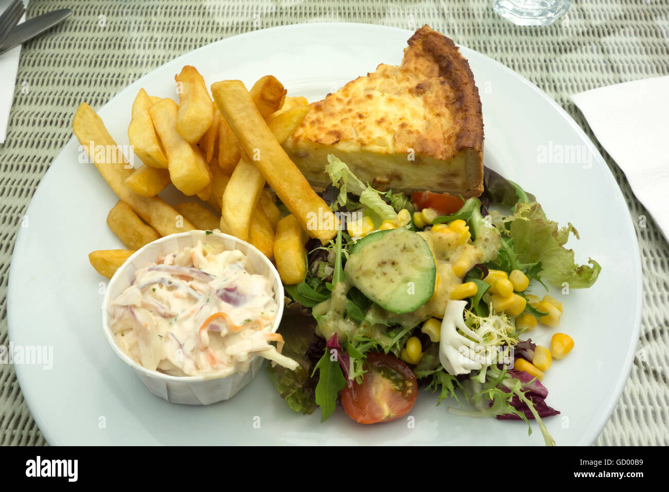 Quiche and chips with salad and coleslaw meal Stock Photo