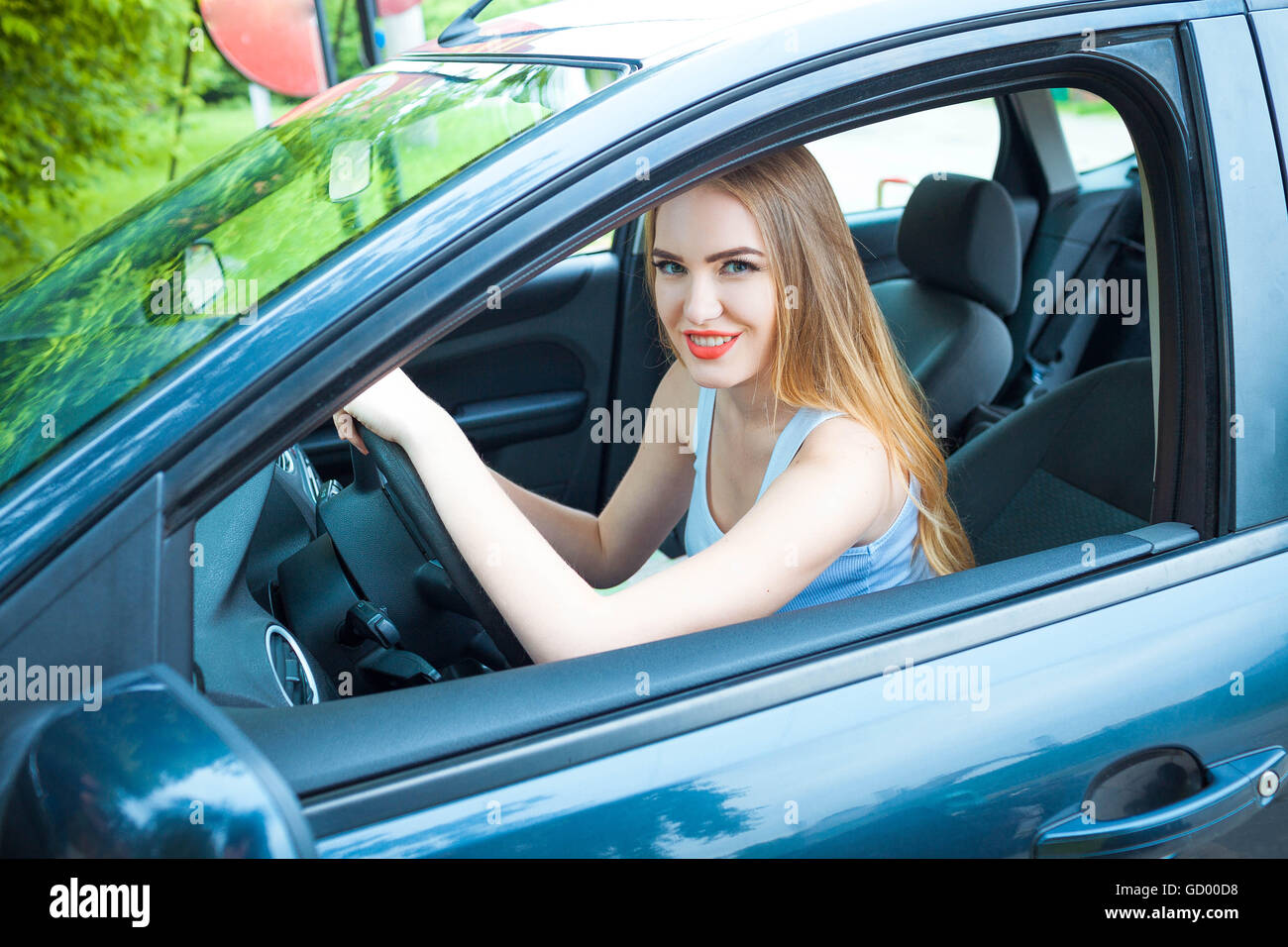 One young girl riding a car Stock Photo - Alamy