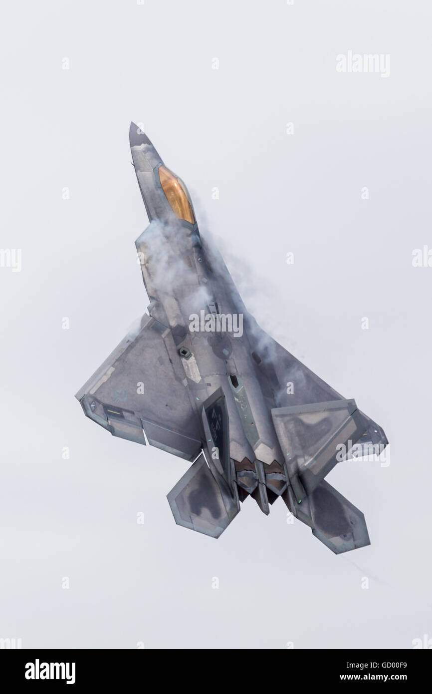 The F-22A Raptor stealth fighter pulls straight into the vertical after take-off at the 2016 Royal International Air Tattoo. Stock Photo