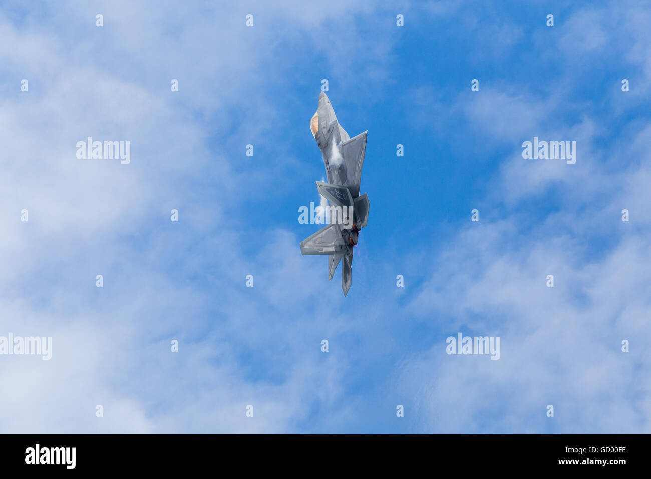F-22A Raptor climbs into the sky at the 2016 Royal International Air Tattoo. Stock Photo