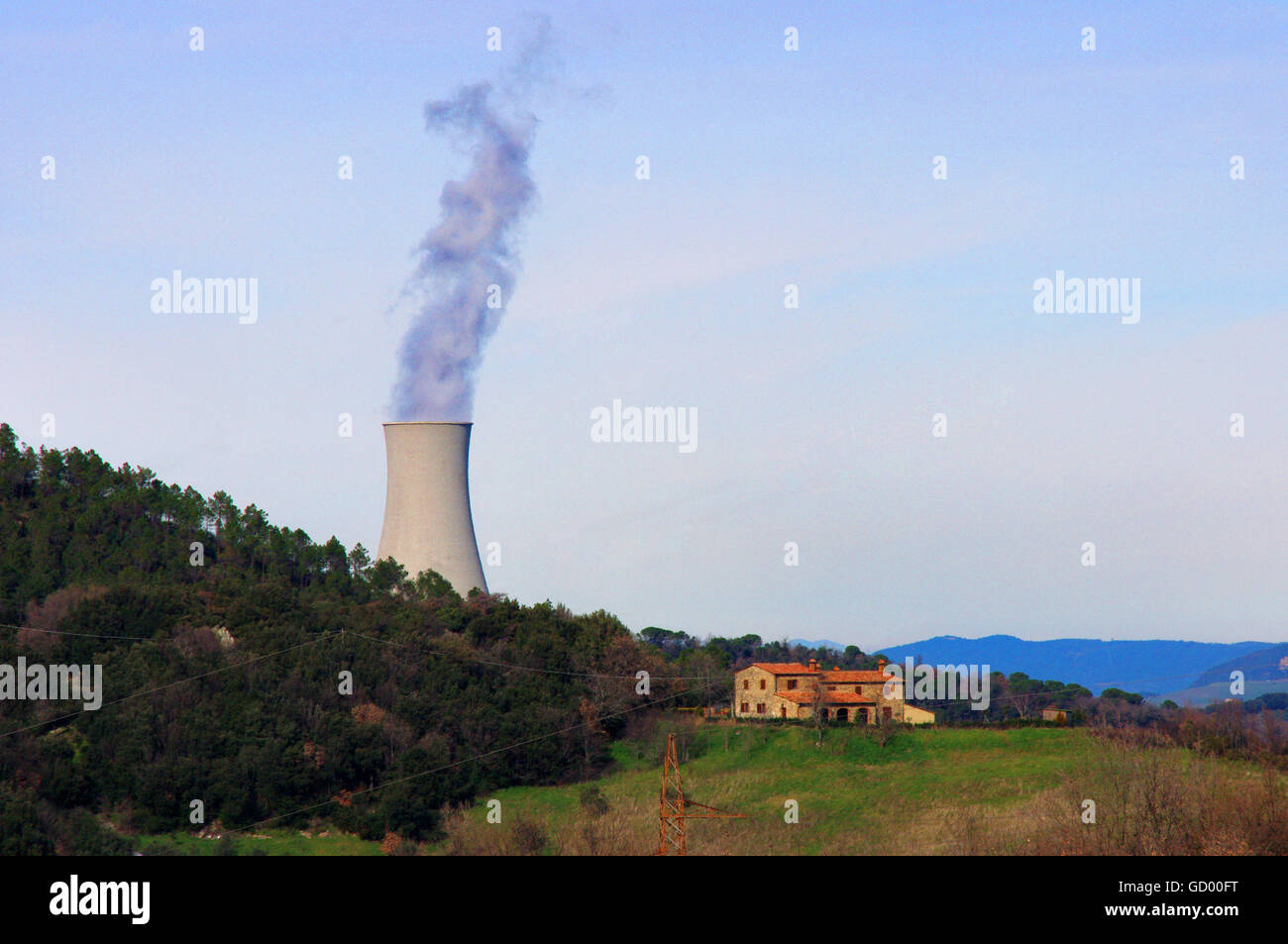 Cooling towers of geothermal plants in the countryside cultivated erificio rural historic Stock Photo