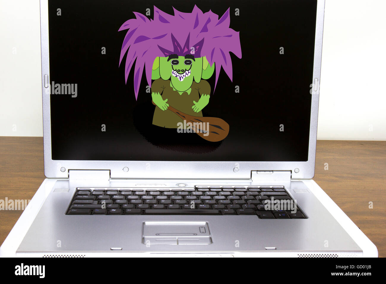 Internet troll on laptop computer screen with large club Stock Photo ...