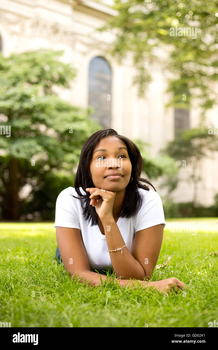 young woman relaxing in the park Stock Photo - Alamy