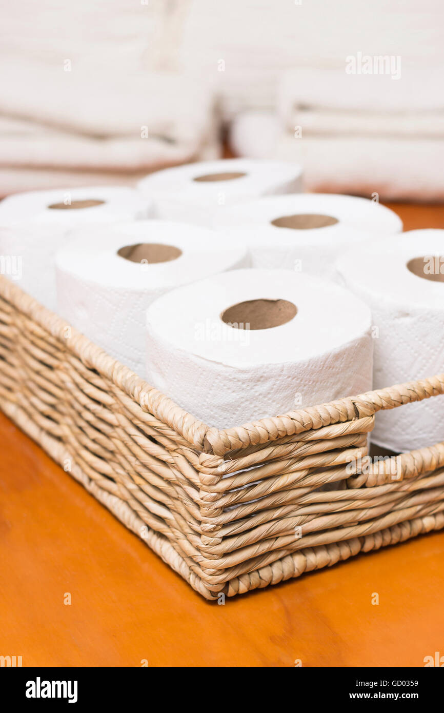 Toilet paper rolls on wicker basket Stock Photo Alamy